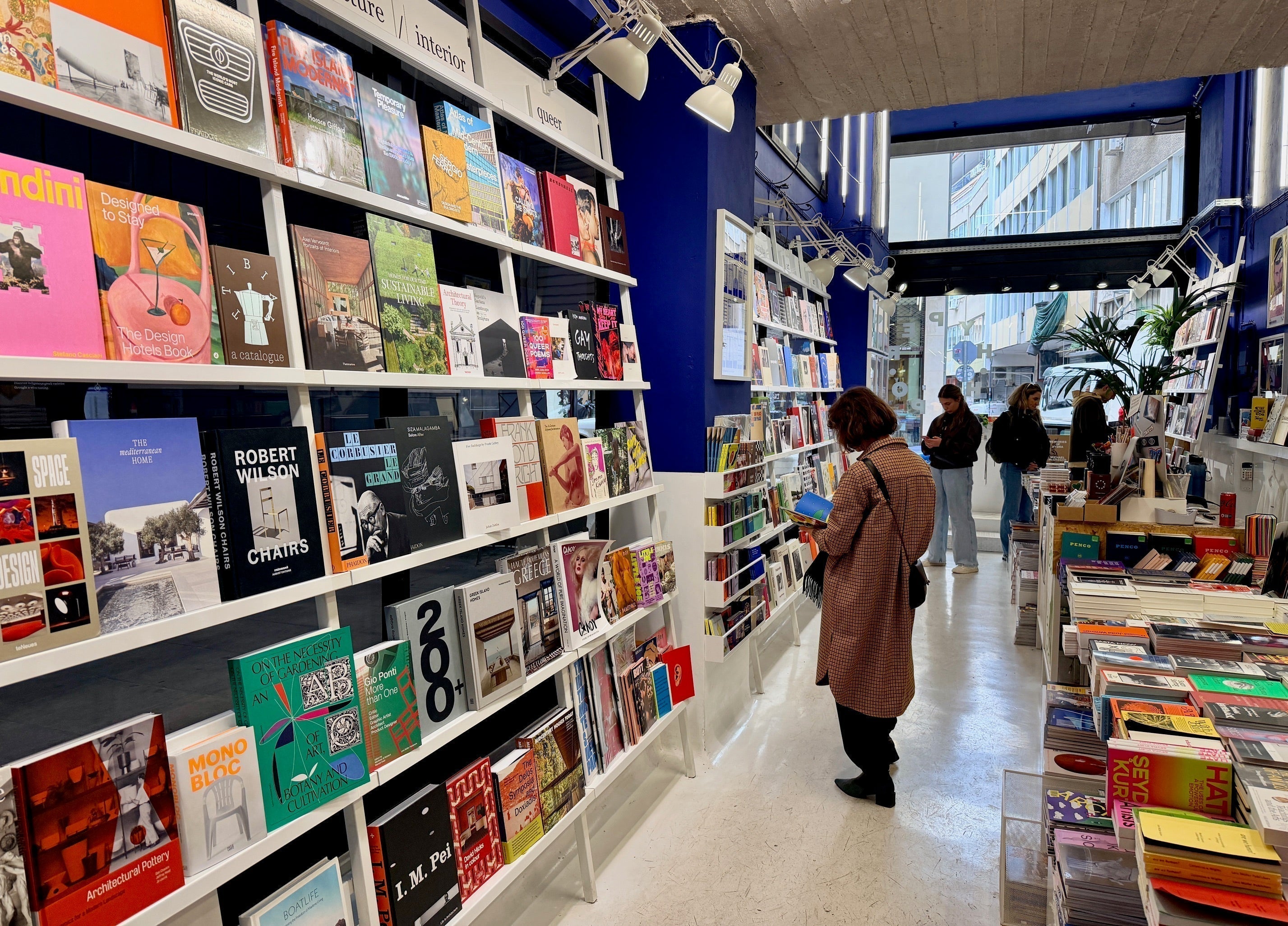 Interior view of a bookstore with shelves of art, design, and photography books.