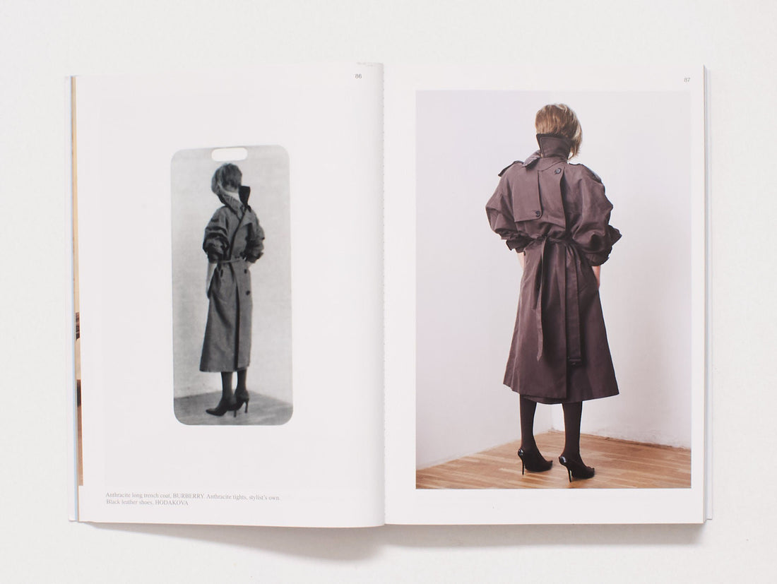 Interior spread featuring black and white and color photography of a person in a trench coat.