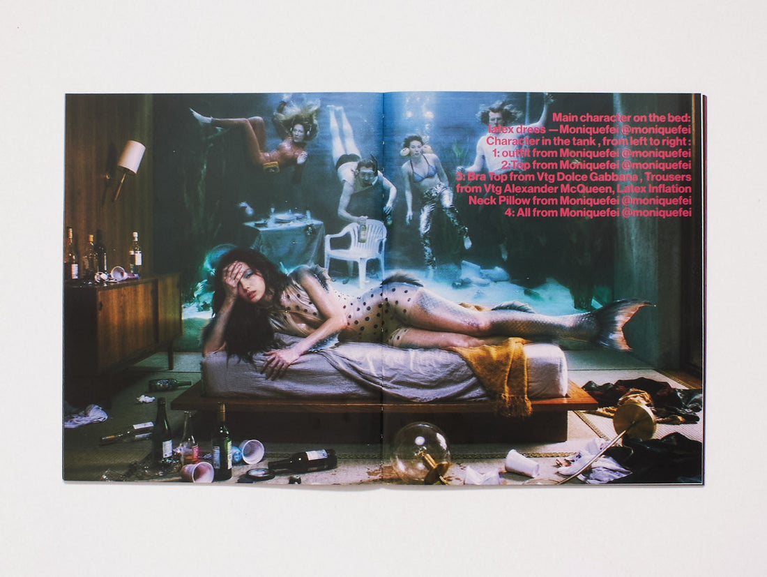 Interior spread featuring a surreal fashion photography scene with multiple models.