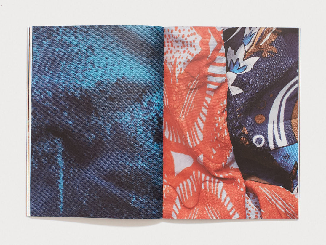 Interior spread featuring abstract blue, red, and patterned textile textures.