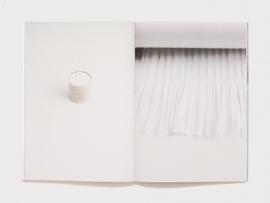 Interior spread showing a white container and a textured white surface.