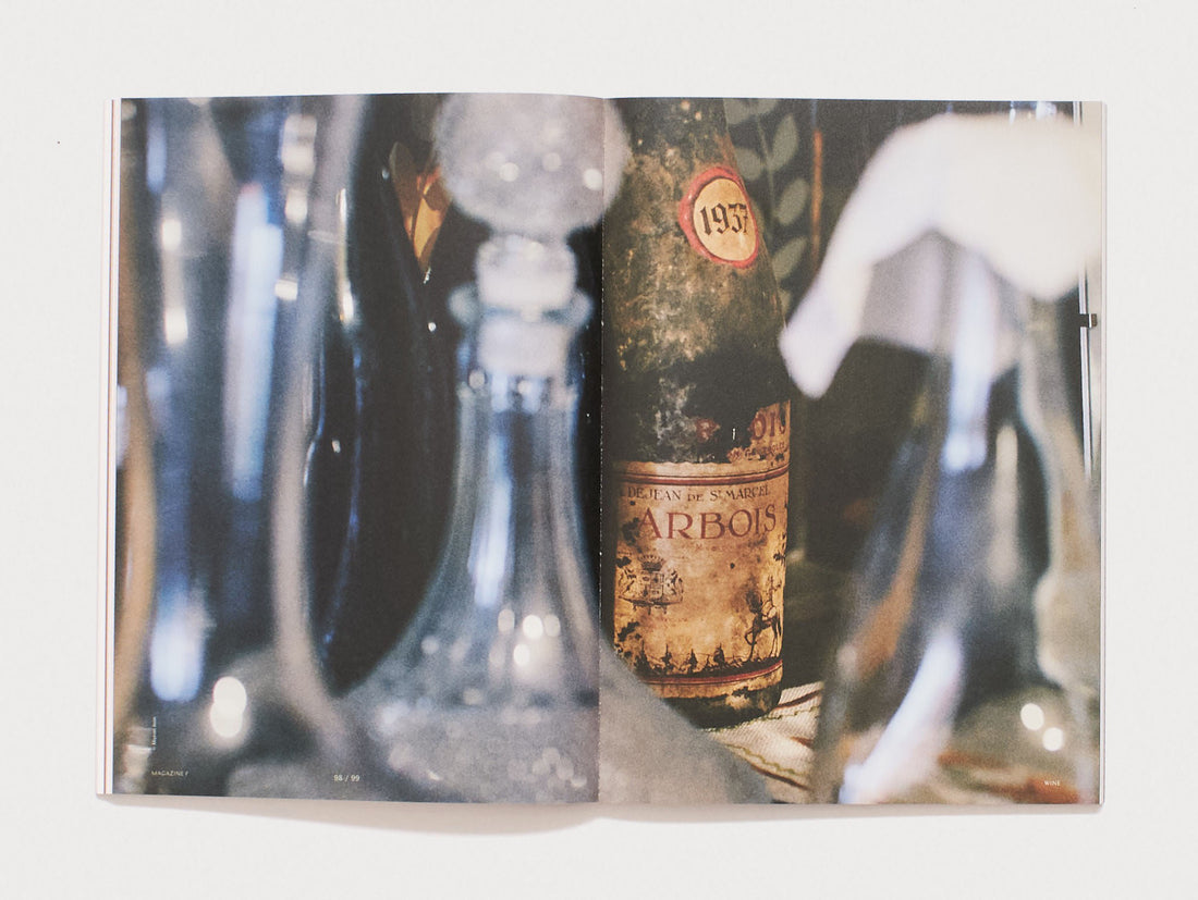 Interior spread from 'MAGAZINE' featuring close-up photography of antique bottles.
